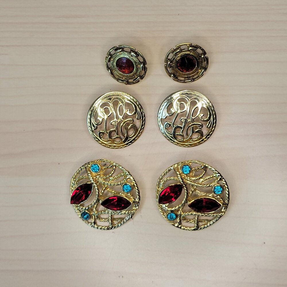 3 Pairs of Gold-Toned Earrings: Red Foil, Filigree Round, Rhinestone Medallion